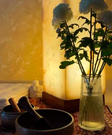 Relaxing spa atmosphere with flowers and singing bowl in Bali